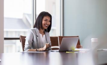 Person with laptop at table