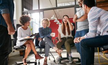 Group of young professionals laughing together