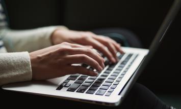 close up of person using laptop