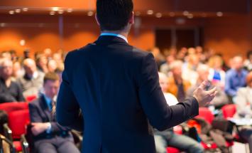 Man presenting at a conference