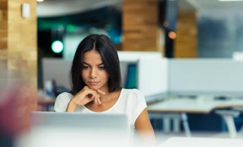 Woman looking at her laptop