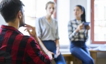 3 people in conversation