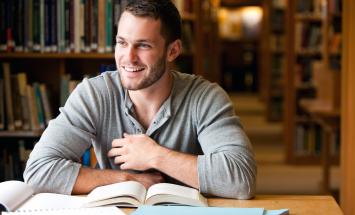 Student in library with books