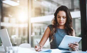 young woman looking at laptop