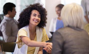 two women handshake