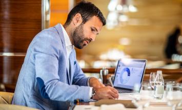 Man working on financial plans on his laptop
