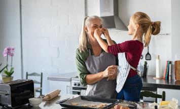 mother and daughter baking in the kitchen at home