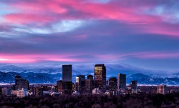 Denver skyline with the Rocky Mountains behind 