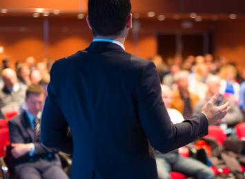 Man presenting at a conference