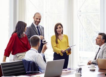 Close up of colleagues connecting in a conference room