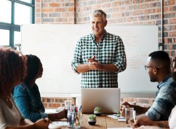 Man leading a discussion with his colleagues