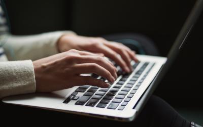 close up of person using laptop