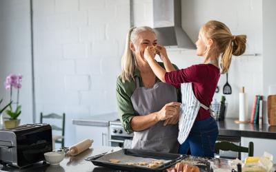 mother and daughter baking in the kitchen at home