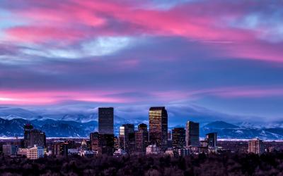 Denver skyline with the Rocky Mountains behind 